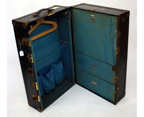 AN EARLY 20TH CENTURY' WATAJOY' HARROD'S LTD., SECRETAIRE TRUNK having a chequered interior 94cm in height 