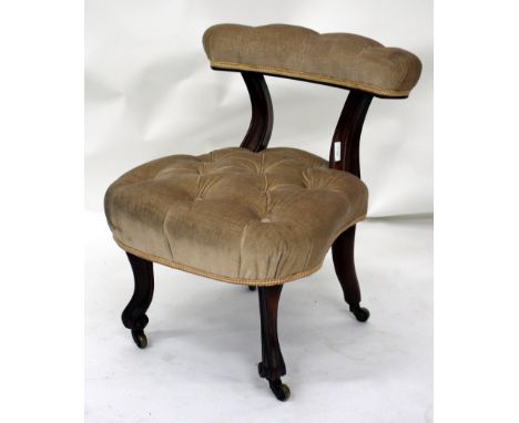 A VICTORIAN LOW CHAIR with upholstered bar back on carved supports, overstuffed button upholstered seat and standing on carve