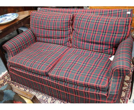A BUTTON UPHOLSTERED TWO SEATER SETTEE with further cushions 158cm wide