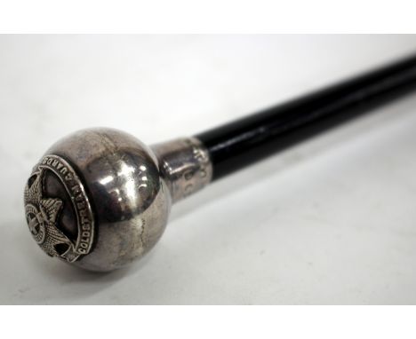 A SILVER TOPPED MID 20TH CENTURY EBONISED SWAGGER STICK, the spherical finial with Coldstream Guards emblem and with marks fo