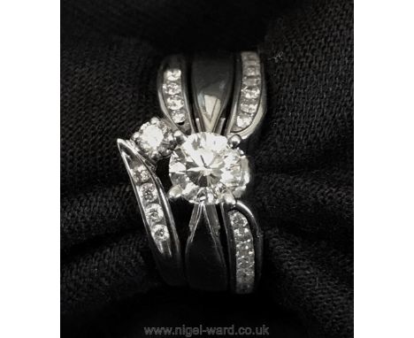 An exquisite Canadian Diamond Bridal set of three contour fit Rings, size M, comprising: a Solitaire Promise Ring with four s