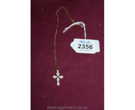 A Gold and opal Cross and chain