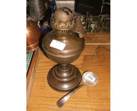 An Oil Lamp and a plated ladle