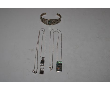 Two 925 silver necklaces with abalone shell decorated pendants and a white metal and abalone shell decorated bangle 