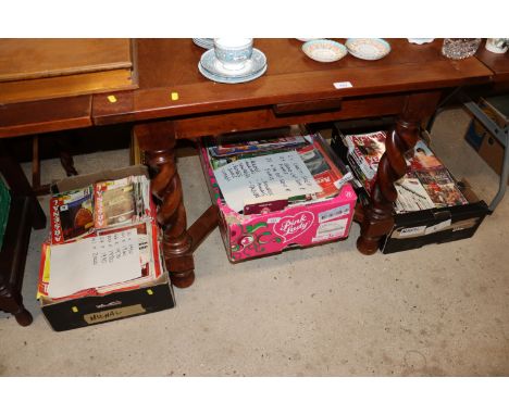 Three boxes of Arsenal football programmes