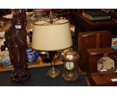 A twin branch brass table lamp and a brass mantel clock