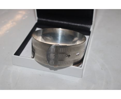 A vintage Sterling silver engine turned buckle bangle, approx. 30gms 
