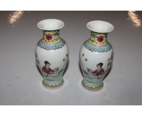 A pair of Chinese vases, painted in coloured enamels, red seal mark to base