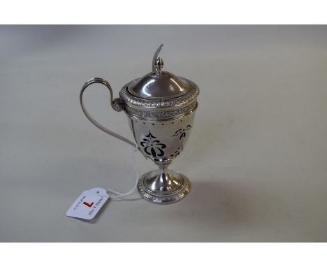 A continental metal pierced baluster lidded mustard pot, 13.5cm' and a .813 ladle.