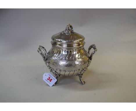 A French export silver lidded sucrier, retailed by J Scheemaecker, Bruxelles, having cast applied scroll handles, feet and kn