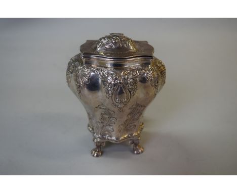 An 18th century style silver tea caddy, by George Unite, Birmingham 1896, of bombe form with hinged cover, and with floral an