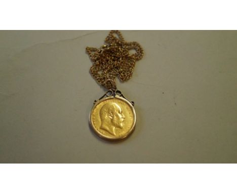 An Edward VII gold sovereign 1910 in 9ct gold pendant mount 9.5g total weight; together with a metal chain necklace.