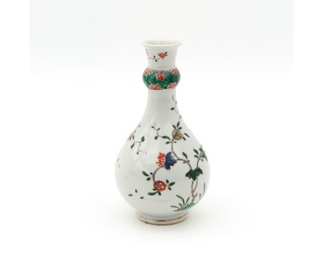 Decorated with flowers, Kangxi Period, 19 cm. tall, neck is restored.