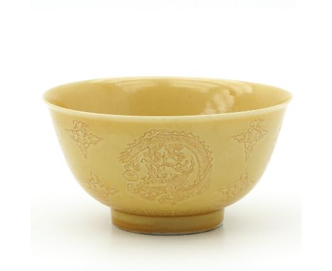 On raised circular base, decorated with dragons and clouds, marked Kangxi, 13 cm. in diameter. 