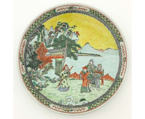 Depicting Chinese figures in garden with mountains in background, Kangxi Mark, 34 cm. in diameter, 34 cm. in diameter. 