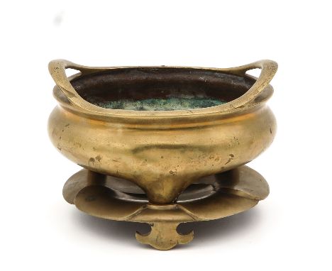 Tripod censer standing on lotus shaped base with incised seal mark on bottom of censer, 23 cm. in diameter. 