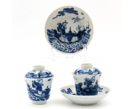 Blue and white decor, depicting Chinese figures, saucers are 13 cm. in diameter, chip and hairline.