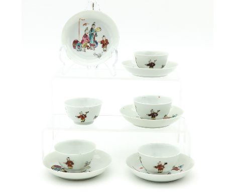 Famille Rose enamels depicting Chinese figures, saucers are 9 cm. in diameter.