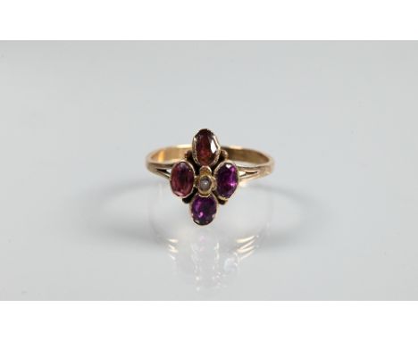 A part Georgian ring formed of quatrefoil set four foil-backed almandine garnets with central seed pearl, gold set, size O 