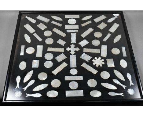 A collection of 18th and 19th century Chinese mother-of-pearl gaming counters including a mounted arrangement of seventy-thre