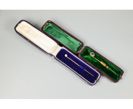 Two stickpins - a single old cut diamond, claw set on stick pin, cased to/w cluster stick pin, cased (2) 