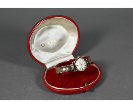 A boxed lady's 9ct gold Omega wristwatch with 17-jewel movement no 17057109, on hexagonal 'bricklink' bracelet, London 1959/6