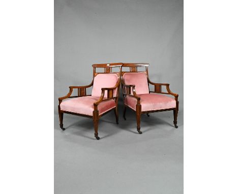 Two companion Edwardian Sheraton Revival style satinwood inlaid rosewood salon armchairs, with conforming pink velour covers,