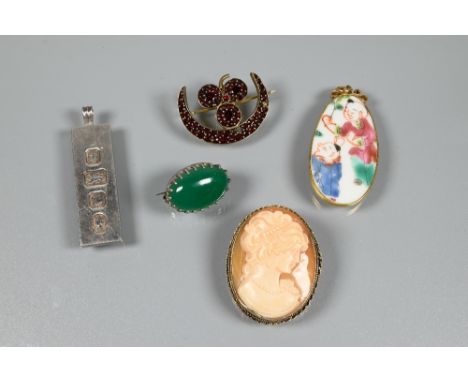 A green cabochon hardstone brooch, oval shell cameo brooch featuring female head, silver ingot pendant, clover leaf and cresc