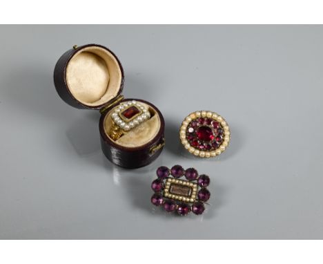 An early 19th century mourning ring, yellow gold set with rectangular seed pearl border enclosing rectangular garnet, size N;