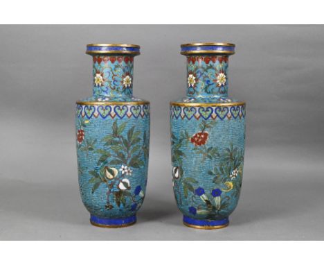 A pair of 19th century Chinese cloisonne on brass rouleau vases decorated in polychrome enamels with flowering and fruiting b
