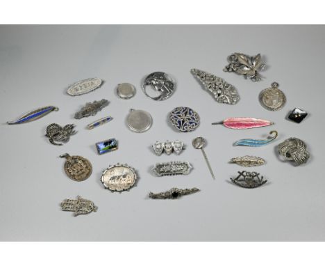 A collection of Victorian and later silver and white metal brooches, pendants and pins including Norwegian sterling silver bl