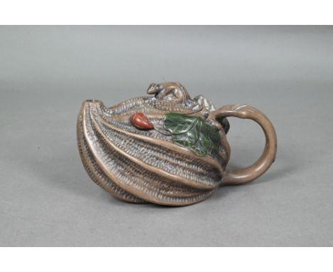 A Chinese naturalistic Yixing teapot and cover with mouse finial and looping vine handle, the body as a ridged and textured p