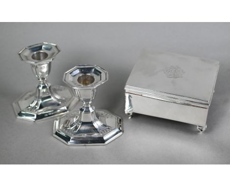 Pair of Edwardian loaded short silver candlesticks, Harrison Bros &amp; Howson, Sheffield 1904, 9cm, to/w a cigarette box on 