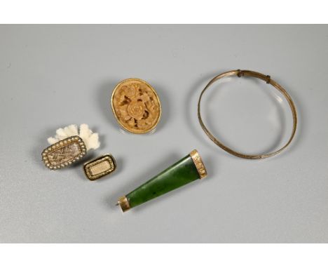 Two Victorian memento mori hairwork brooches, one with seed pearl surround, a green hardstone brooch, a floral carved brooch 