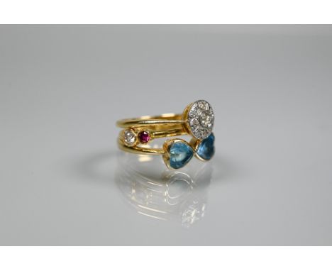 Three various 18ct gold rings comprising a circular platinum set diamond cluster, size O; a pair of interfacing topaz-set (pr