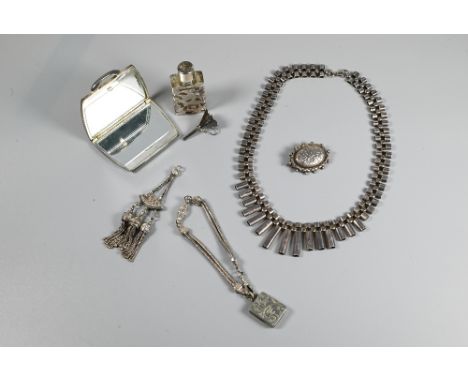 A silver necklace of graduated tubular links, 38 cm long (open); oval brooch with attached pendant and a mesh bracelet with a