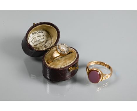 A Victorian 22ct ring set with oval diamond and pearl cluster, size N, to/w a chalcedony set signet ring, size N (2)Condition