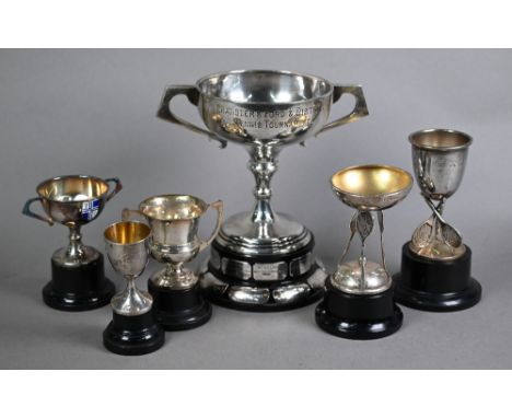 Silver two-handled trophy cup on plinth mounted with plaques, to/w two small tennis trophies another small trophy cup, Chines