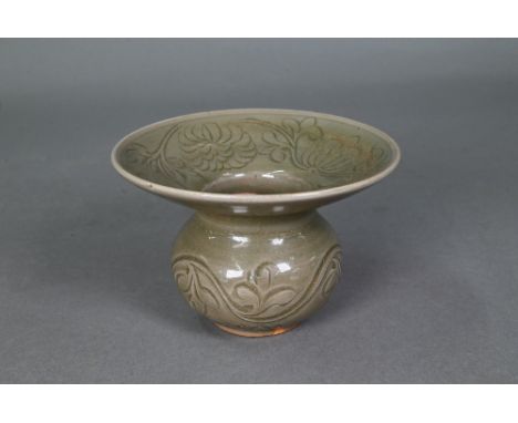 A Chinese Yaozhou celadon cuspidor (zha dou) in the Northern Song dynasty style, incised with flowering peony scroll and comb