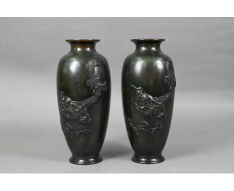 A pair of Japanese base metal vases cast in high relief with fierce three-clawed dragons, simulated verdigris bronzed finish,