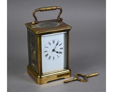 A traditional brass carriage clock, the 8-day twin drum movement with white enamelled dial (unsigned), 13.5 cm h, c/w key - n