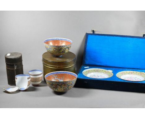 Two 20th century Chinese egg-shell porcelain bowls painted interiors with phoenix and feather-scroll on coral ground with blu