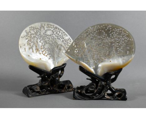 A pair of 19th century Chinese mother-of-pearl ornamental shells, late Qing dynasty, each one intricately carved and pierced 