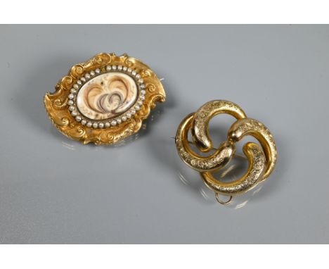 Two Victorian brooches - one with yellow metal shaped mount enclosing seed pearl and hairwork memento mori, 5 x 3.5 cm and a 