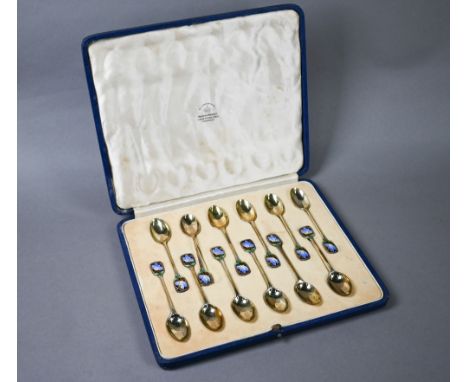 Cased set of twelve Art Deco silver gilt coffee spoons with finials pierced and enamelled with butterflies, Mappin & Webb, Sh