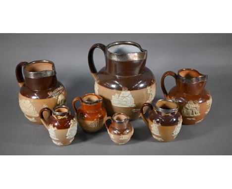 Matched set of eight Royal Doulton stoneware jugs with silver rims, 19-4.5 cm, one commemorating Shakespeare (8) 