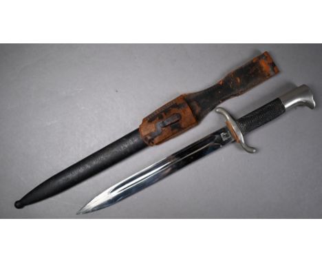 A German Fire/Police dagger with 24 cm fullered Eickhorn blade and two piece hatched grip, in steel scabbard with leather fro