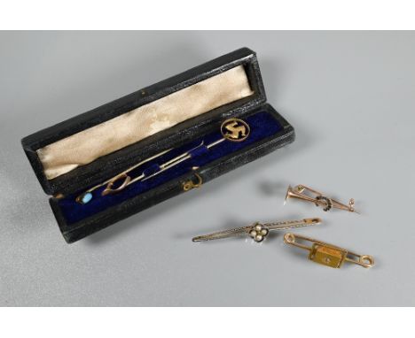 A Victorian yellow gold bar brooch with central bloomed gold rectangle with starburst diamond to middle; a yellow and white g