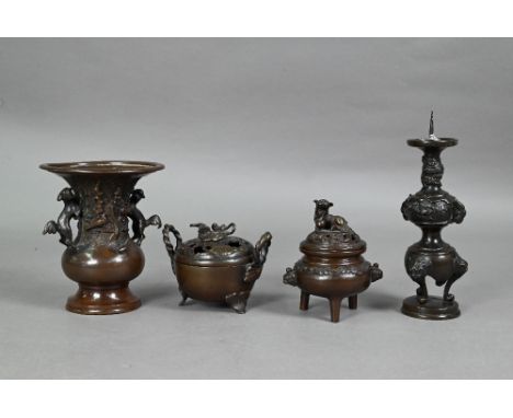 Four late 19th or early 20th century Japanese bronzes comprising a small baluster vase with flared neck and Karashish handles