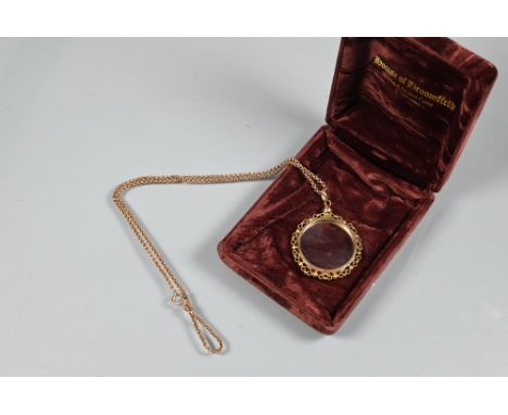 A 9ct rose gold belcher chain with vacant spectacle mount locket attached, with bead and scroll surround, approx 14.3g all in